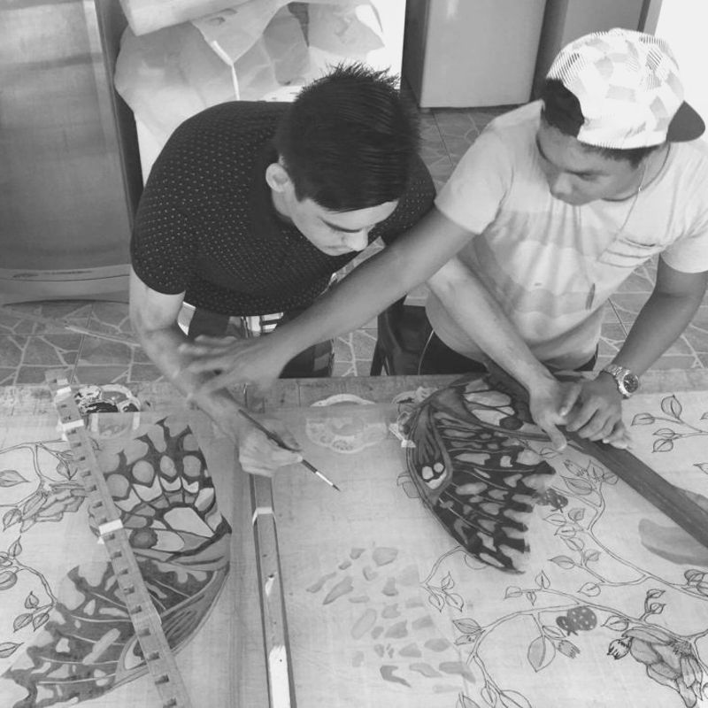 young autistic artist working with his mentor